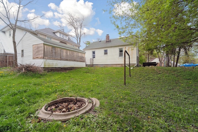 view of yard featuring an outdoor fire pit