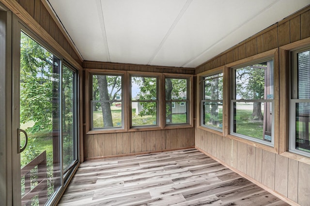 3217 Westminster Dr SE Unit 69, Grand Rapids, MI 49512 - unfurnished sunroom featuring wooden walls, wood finished floors, and healthy amount of natural light
