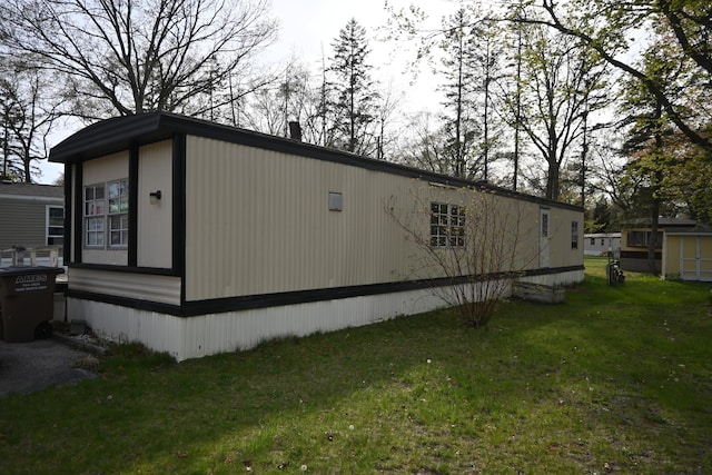 view of side of home featuring a yard