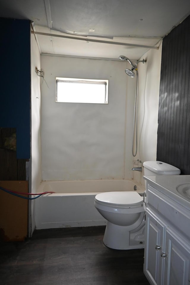 full bathroom featuring toilet, wood finished floors, shower / washtub combination, and vanity