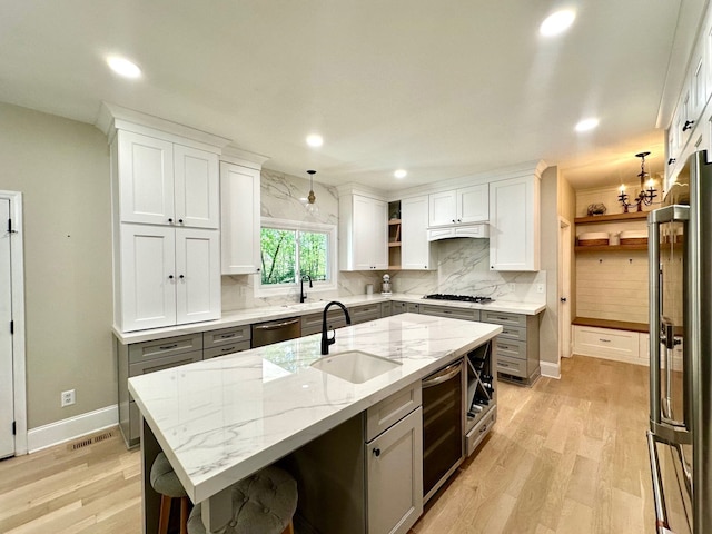 kitchen with a sink, open shelves, dishwasher, wine cooler, and refrigerator