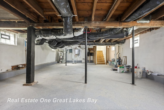below grade area with stairway and heating unit