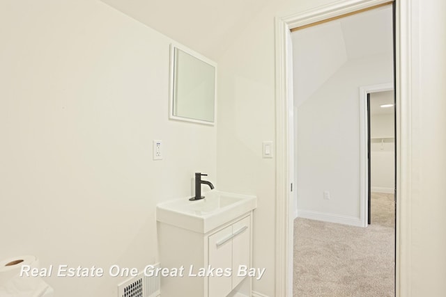 bathroom featuring vanity and baseboards