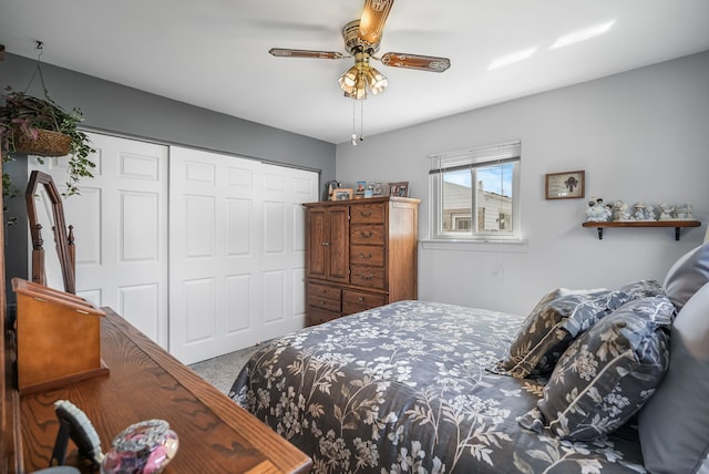 carpeted bedroom with a closet and ceiling fan