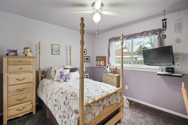 bedroom featuring dark carpet, baseboards, and a ceiling fan