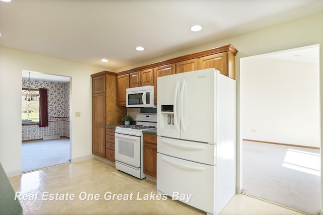kitchen featuring white appliances, light colored carpet, brown cabinetry, recessed lighting, and baseboards