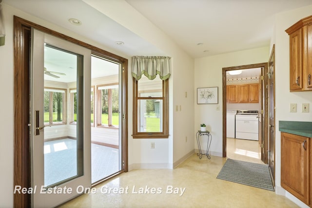 doorway with washer and dryer, baseboards, a ceiling fan, and recessed lighting