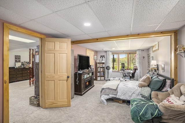 2660 Barber Rd, Grass Lake, MI 49240 - bedroom featuring light colored carpet, a drop ceiling, and a fireplace