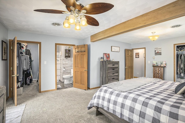 2660 Barber Rd, Grass Lake, MI 49240 - bedroom with a spacious closet, a closet, light colored carpet, baseboards, and beam ceiling