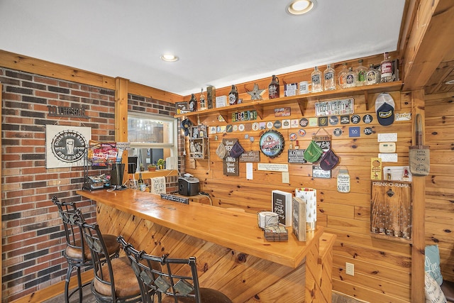2660 Barber Rd, Grass Lake, MI 49240 - bar area with wooden walls, brick wall, and recessed lighting