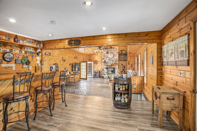 2660 Barber Rd, Grass Lake, MI 49240 - bar area with wooden walls, recessed lighting, and wood finished floors