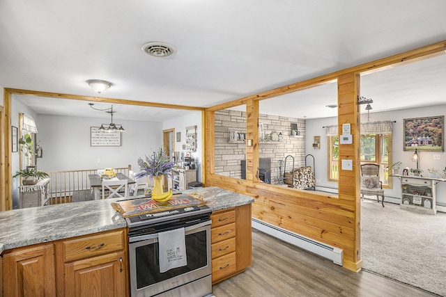2660 Barber Rd, Grass Lake, MI 49240 - kitchen featuring baseboard heating, plenty of natural light, stainless steel range with electric cooktop, and light wood-style floors