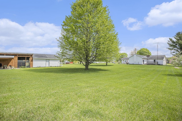2660 Barber Rd, Grass Lake, MI 49240 - view of grassy yard with an outbuilding and a pole building
