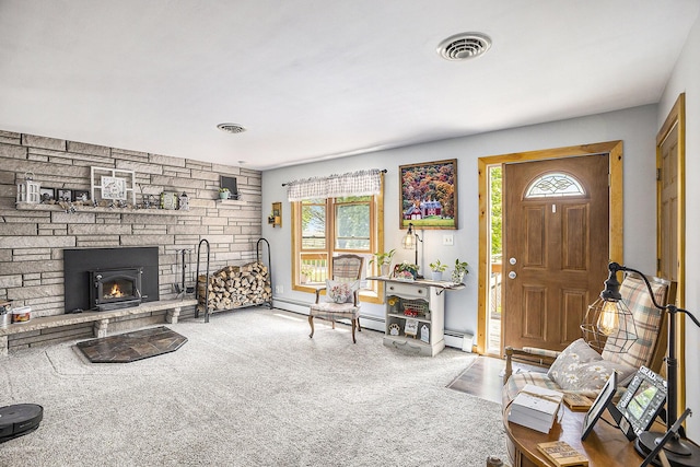 2660 Barber Rd, Grass Lake, MI 49240 - living area with healthy amount of natural light, baseboard heating, and a stone fireplace