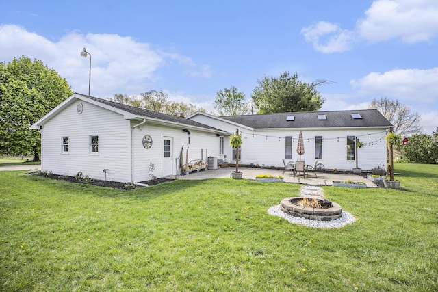 2660 Barber Rd, Grass Lake, MI 49240 - back of property featuring a fire pit, a patio area, and a yard