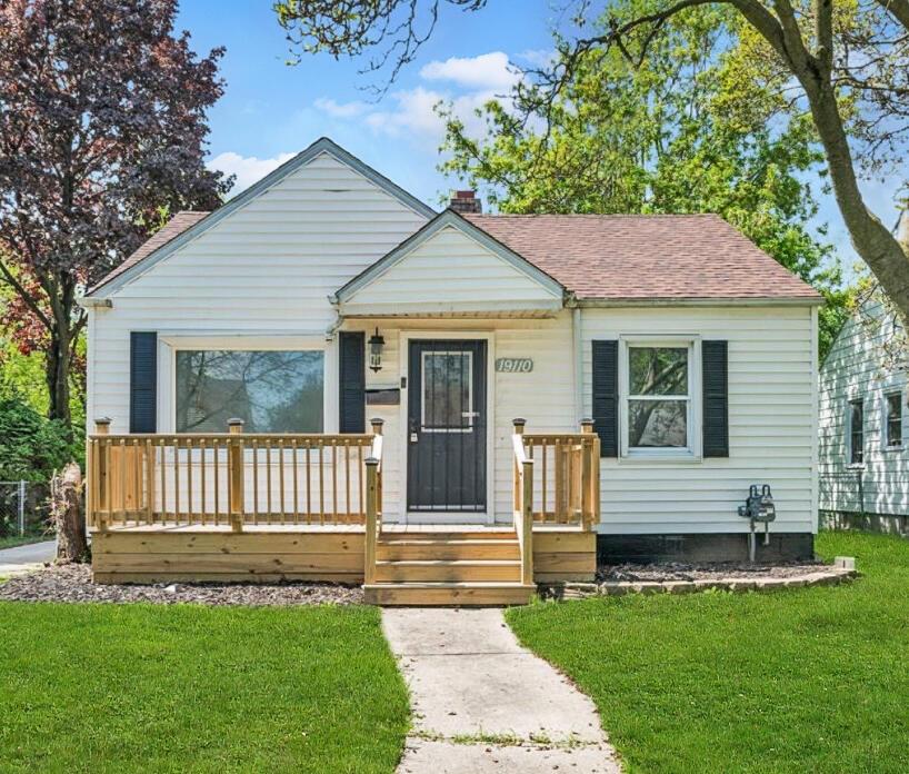 19110 Kingsville St, Harper Woods, MI 48225 - bungalow with a front yard, a chimney, and a shingled roof
