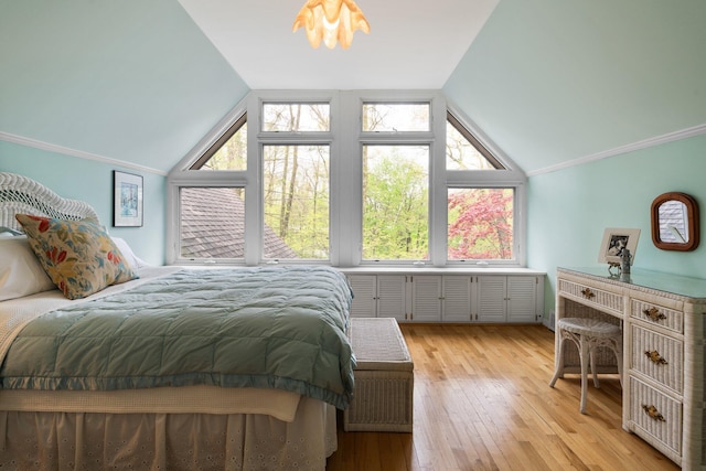 bedroom featuring vaulted ceiling and light wood-style floors