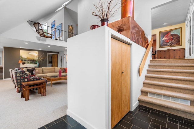 stairs with baseboards, carpet, tile patterned floors, and recessed lighting