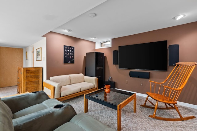 living area with light colored carpet and baseboards
