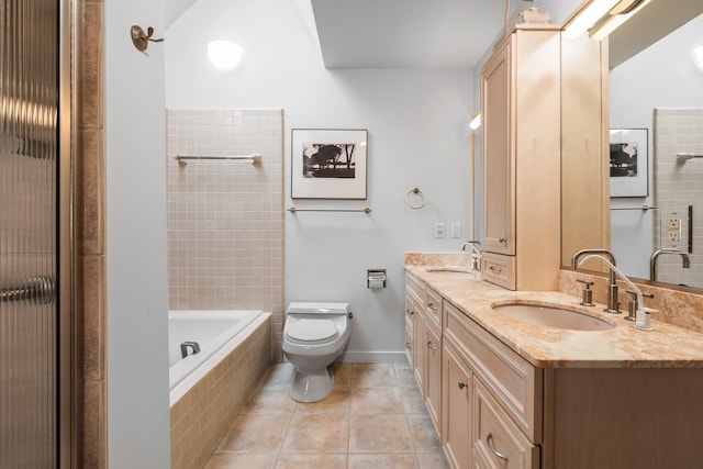 bathroom featuring tile patterned floors, toilet, a shower, double vanity, and tiled bath