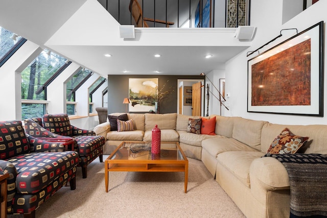 carpeted living room featuring a towering ceiling and recessed lighting