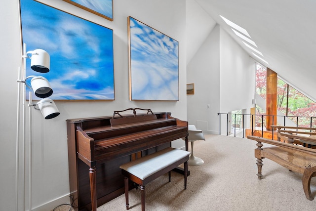 living area featuring carpet, lofted ceiling, baseboards, and an upstairs landing