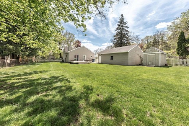 view of yard with a storage shed and an outdoor structure