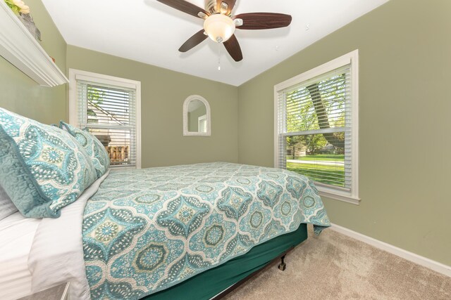 bedroom with carpet floors, baseboards, and ceiling fan