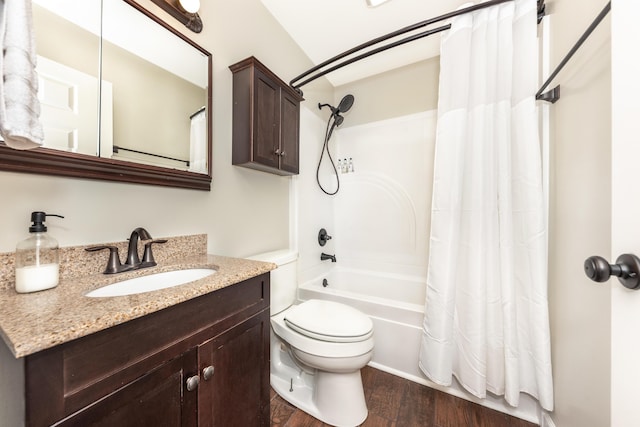 bathroom with wood finished floors, toilet, shower / tub combo, and vanity
