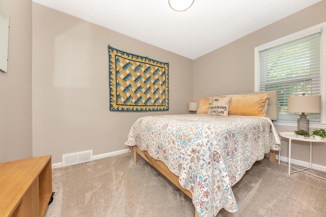 bedroom with carpet flooring and baseboards