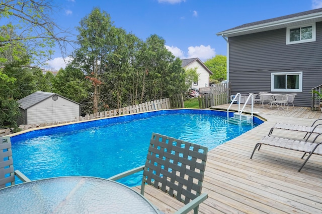 2394 Cedar Crest Dr NE, Grand Rapids, MI 49525 - view of pool featuring outdoor dining area, fence, and a wooden deck