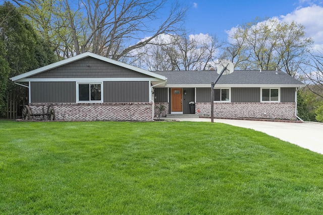 2394 Cedar Crest Dr NE, Grand Rapids, MI 49525 - single story home featuring a front lawn, a shingled roof, brick siding, and a chimney