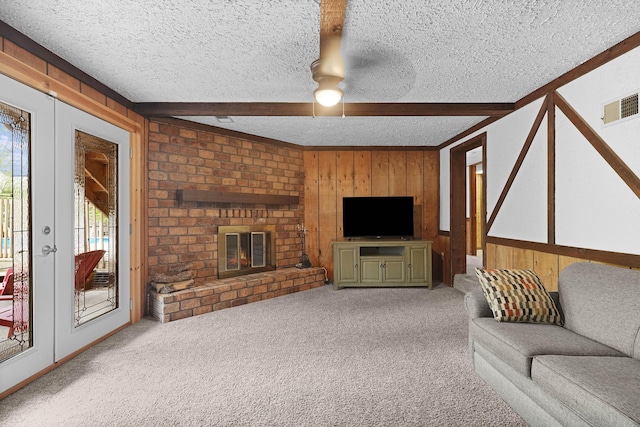 2394 Cedar Crest Dr NE, Grand Rapids, MI 49525 - unfurnished living room with a textured ceiling, wood walls, healthy amount of natural light, beam ceiling, and carpet floors