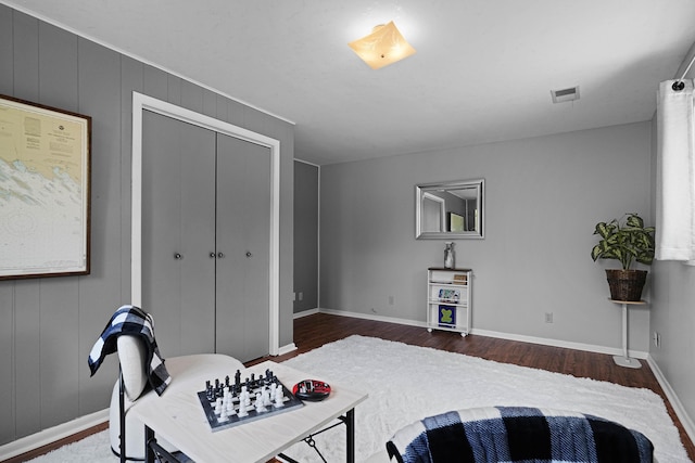 2394 Cedar Crest Dr NE, Grand Rapids, MI 49525 - bedroom with dark wood finished floors, baseboards, and a closet