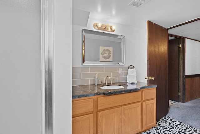 2394 Cedar Crest Dr NE, Grand Rapids, MI 49525 - bathroom with backsplash and vanity