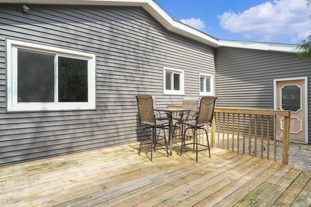 2394 Cedar Crest Dr NE, Grand Rapids, MI 49525 - wooden deck with outdoor dining area