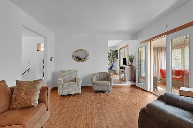 2394 Cedar Crest Dr NE, Grand Rapids, MI 49525 - living room featuring light wood-style floors and baseboards