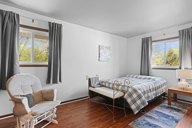 2394 Cedar Crest Dr NE, Grand Rapids, MI 49525 - bedroom featuring wood finished floors, multiple windows, and baseboards