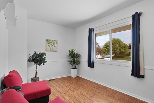 2394 Cedar Crest Dr NE, Grand Rapids, MI 49525 - living area featuring wood finished floors and baseboards