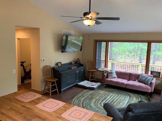 15205 Riverview Rd SE, Grayling, MI 49738 - living area featuring vaulted ceiling, dark wood-style flooring, and a ceiling fan