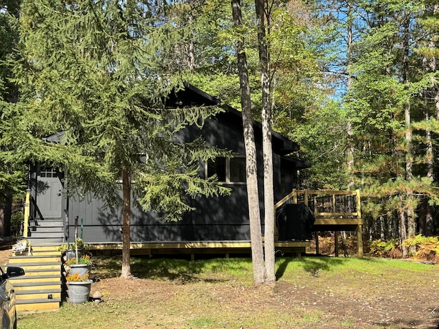 15205 Riverview Rd SE, Grayling, MI 49738 - view of yard featuring a wooden deck and stairs