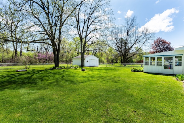 5200 N Jennings Rd, Flint, MI 48504 - view of yard featuring a garage and an outbuilding