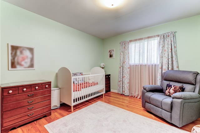 5200 N Jennings Rd, Flint, MI 48504 - bedroom featuring wood finished floors and baseboards