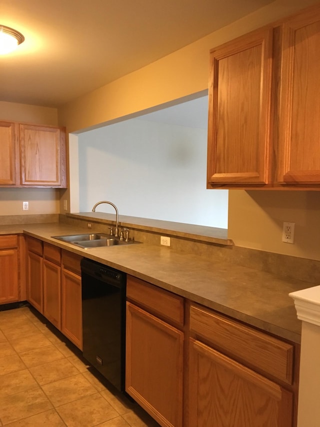 kitchen with dishwasher, a sink, and light tile patterned floors
