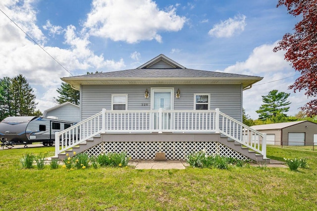 220 S Berrien St, New Buffalo, MI 49117 - view of front of house with stairs and a front lawn
