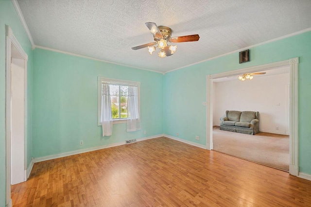 220 S Berrien St, New Buffalo, MI 49117 - empty room with ceiling fan, ornamental molding, wood finished floors, and baseboards