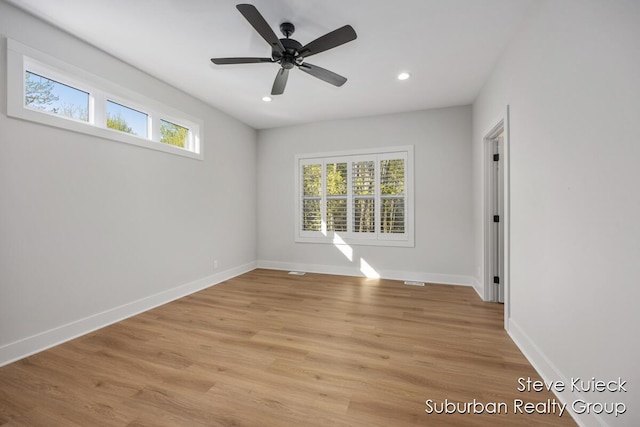 unfurnished room featuring recessed lighting, baseboards, light wood-style flooring, and a ceiling fan