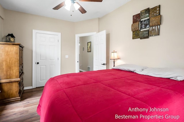 bedroom with wood finished floors, baseboards, and ceiling fan