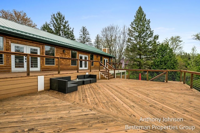 deck with french doors and an outdoor hangout area