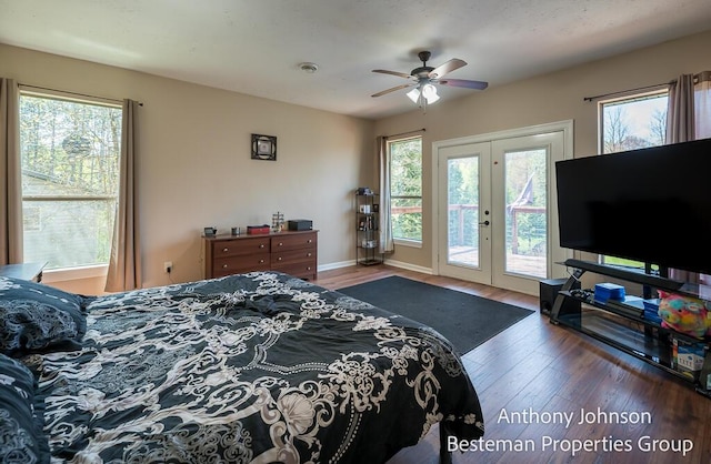 bedroom featuring access to outside, french doors, wood finished floors, and baseboards